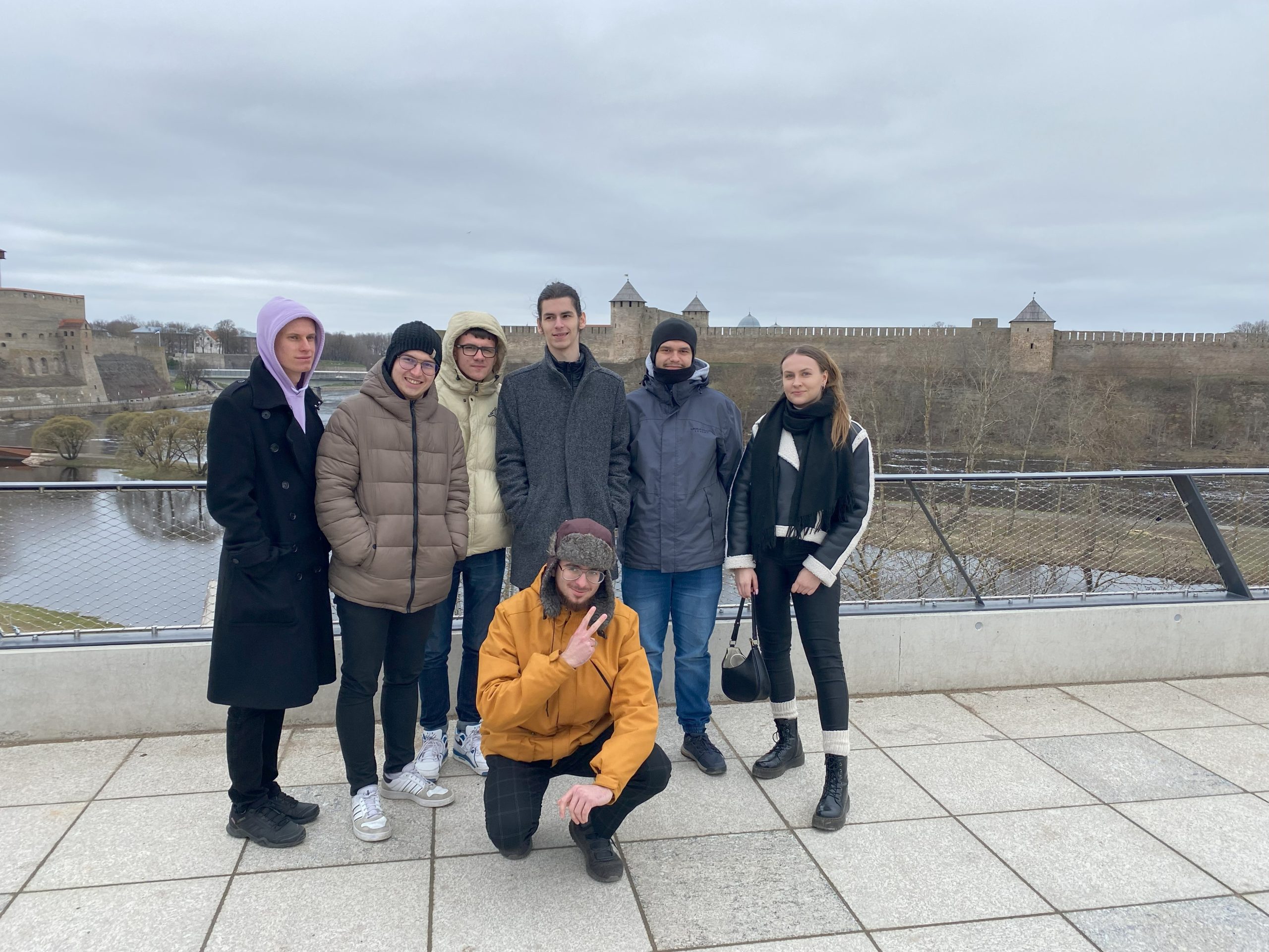 seven people standing outdoors