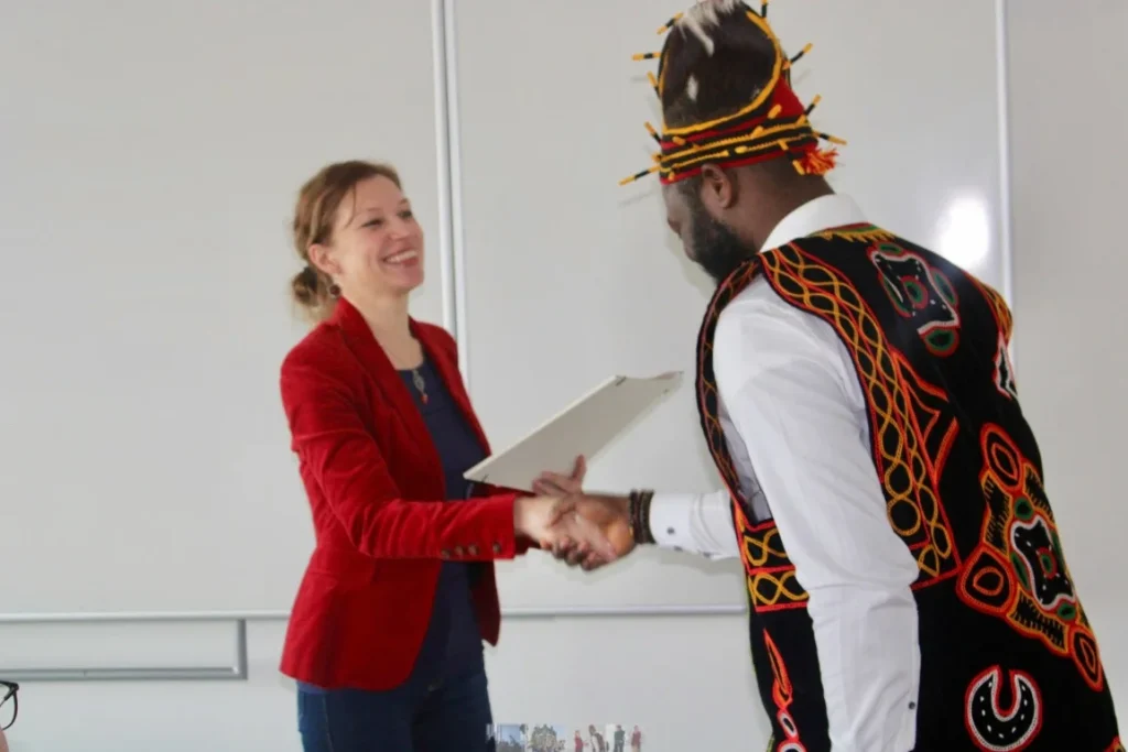 a woman shaking hands with a man